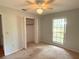 Cozy bedroom with window for natural light, neutral walls, and closet for storage at 6116 Sweet Gum Run, Bartow, FL 33830