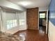 Bright breakfast nook features brick accent wall, and an abundance of natural light at 6116 Sweet Gum Run, Bartow, FL 33830