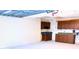 A bright garage featuring wall-to-wall pegboard, cabinet storage, and painted floors at 6116 Sweet Gum Run, Bartow, FL 33830