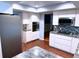 Updated kitchen with stainless steel appliances, granite countertops, and mosaic backsplash at 6116 Sweet Gum Run, Bartow, FL 33830