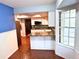 An eat-in kitchen features an island bar with granite counters, mosaic backsplash and recessed lighting at 6116 Sweet Gum Run, Bartow, FL 33830