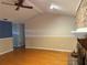 Bright living room with hardwood floors, fireplace, and wainscoting at 6116 Sweet Gum Run, Bartow, FL 33830