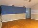 Spacious living room with hardwood floors and two-tone walls at 6116 Sweet Gum Run, Bartow, FL 33830