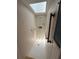 Bright, tiled shower stall with a skylight, grab bars, and shower fixtures at 6116 Sweet Gum Run, Bartow, FL 33830