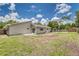 Spacious backyard featuring a well-maintained lawn, privacy fence, and inviting patio, perfect for outdoor enjoyment at 6338 Oak E Sq, Lakeland, FL 33813