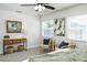 A bedroom has a wood console table and two chairs on either side of the bed at 6338 Oak E Sq, Lakeland, FL 33813