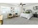 A bedroom has a ceiling fan and matching end tables on either side of the bed at 6338 Oak E Sq, Lakeland, FL 33813