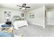 A bedroom has a bed between two matching chairs and artwork on the wall at 6338 Oak E Sq, Lakeland, FL 33813