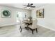Cozy dining area featuring a round table with seating for four, a ceiling fan, and stylish decor at 6338 Oak E Sq, Lakeland, FL 33813