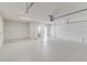 Bright garage with a clean floor, white walls, and convenient access to the outdoors at 6338 Oak E Sq, Lakeland, FL 33813