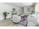 Comfortable living room boasts stylish furnishings, neutral color palette, and new flooring at 6338 Oak E Sq, Lakeland, FL 33813