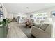 Open-concept living space seamlessly connects to a modern kitchen, providing a spacious and inviting atmosphere at 6338 Oak E Sq, Lakeland, FL 33813