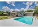 Backyard pool showcasing clear water, a large patio, and the home's exterior at 6338 Oak E Sq, Lakeland, FL 33813