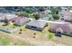 Aerial rear view of a single Gathering home featuring a small yard with limited landscaping at 6339 Alamanda Hills Dr, Lakeland, FL 33813