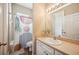 Bright bathroom with a shower, vanity and tile flooring, well-maintained at 6339 Alamanda Hills Dr, Lakeland, FL 33813