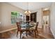 Elegant dining room with a glass table, unique chairs, and a decorative chandelier at 6339 Alamanda Hills Dr, Lakeland, FL 33813