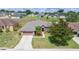 Charming single-story home featuring a well-manicured lawn and an attached two-car garage at 6339 Alamanda Hills Dr, Lakeland, FL 33813
