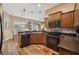 Bright kitchen features wood cabinets, modern appliances, and wood-look flooring at 6339 Alamanda Hills Dr, Lakeland, FL 33813