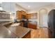 A view of the kitchen showing wood cabinets and countertops at 6339 Alamanda Hills Dr, Lakeland, FL 33813