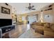 Spacious living room with a sliding glass door, ceiling fan, and a cozy sectional sofa at 6339 Alamanda Hills Dr, Lakeland, FL 33813