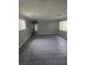 Spacious living room with tile floors and natural light, offering a versatile space for relaxation at 6632 Sweetbriar Ln, Lakeland, FL 33813