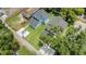 Aerial view of two homes with a well-manicured lawn, private driveways and mature trees at 727 S Missouri Ave, Lakeland, FL 33815