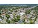 Enjoy the neighborhood's charm from above, with views of local buildings and the lake in the distance at 727 S Missouri Ave, Lakeland, FL 33815