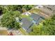 Aerial view of the two homes with private driveways, mature trees, and well maintained lawn at 727 S Missouri Ave, Lakeland, FL 33815