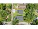 Aerial view of the two homes with private driveways, mature trees, and well maintained lawn at 727 S Missouri Ave, Lakeland, FL 33815