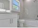 Bathroom featuring a tub, a shower, a sink, a toilet, and bright lighting at 727 S Missouri Ave, Lakeland, FL 33815