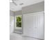 Bedroom with natural light from the window, plus a modern ceiling fan and a double door closet at 727 S Missouri Ave, Lakeland, FL 33815