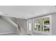 Open-concept entry featuring staircase and natural lighting at 727 S Missouri Ave, Lakeland, FL 33815