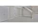 Open-concept living space with stairs to the second floor and entry doors at 727 S Missouri Ave, Lakeland, FL 33815