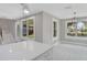Open-concept living room boasts large windows, modern lighting, and easy access to stairs at 727 S Missouri Ave, Lakeland, FL 33815