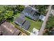 An aerial view reveals the property's location, roof, yard, and surrounding neighborhood streets at 731 S Missouri Ave, Lakeland, FL 33815