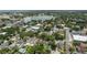Picturesque aerial shot features homes near a lake, highlighting lush greenery and city views at 731 S Missouri Ave, Lakeland, FL 33815