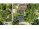 Aerial view showing the home's position on a large lot with proximity to neighborhood streets at 731 S Missouri Ave, Lakeland, FL 33815