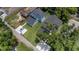Aerial view showcasing a property's neatly kept lawn, matching roof, and a car parked on driveway at 731 S Missouri Ave, Lakeland, FL 33815