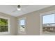 Neutral room showing three well-lit windows that showcase the exterior and enhance natural light at 731 S Missouri Ave, Lakeland, FL 33815