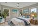 Staged bedroom featuring beach themed artwork, and a ceiling fan at 731 S Missouri Ave, Lakeland, FL 33815