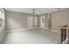 Bonus room with grey walls, light floors, staircase, and multiple windows providing ample natural light at 731 S Missouri Ave, Lakeland, FL 33815