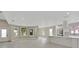 Bright open-concept kitchen with a large island, white cabinets, and modern appliances at 731 S Missouri Ave, Lakeland, FL 33815