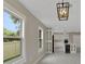 Bright and airy kitchen with a large island, white cabinets, stainless steel appliances, and modern lighting at 731 S Missouri Ave, Lakeland, FL 33815