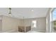 Well-lit landing featuring new flooring and contemporary railing, with windows providing natural light at 731 S Missouri Ave, Lakeland, FL 33815