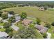 Bird's eye view of home, with large yard and neighborhood, featuring a vast field at 7932 Ridge Pointe W Dr, Lakeland, FL 33810