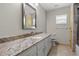 Bathroom featuring granite counters and tiled floors at 7932 Ridge Pointe W Dr, Lakeland, FL 33810