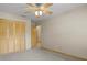 Bedroom with neutral carpet and large closet at 7932 Ridge Pointe W Dr, Lakeland, FL 33810