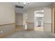 The dining room has gray carpet and has access to other rooms in the house at 7932 Ridge Pointe W Dr, Lakeland, FL 33810