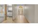 Foyer featuring tile floors leading to a laundry room, and front door at 7932 Ridge Pointe W Dr, Lakeland, FL 33810