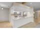 Well-equipped kitchen featuring stainless steel appliances, modern backsplash, and quartz countertops at 7932 Ridge Pointe W Dr, Lakeland, FL 33810
